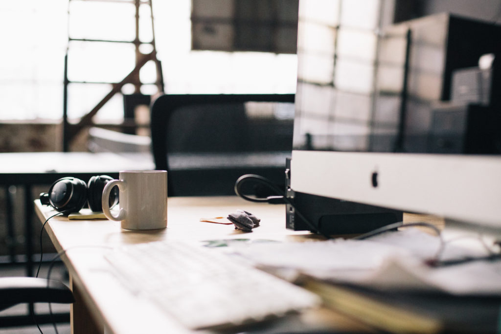 Photo of a work desk with computer screen and coffee mug, used in a blog post regarding making a habit of regularly generating new business and filling the sales pipeline for small business, written by Phoebe Netto, founder of Good Business Consulting ,  a  PR Firm from Sydney. 