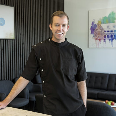 Dr David Hills, founder of iNEEDa Dentist, standing in dentist waiting room